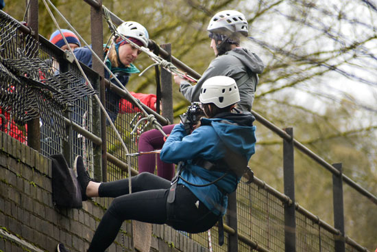 Blue Peter presenter Abby Cook abseiling at Millers Dale
